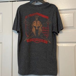 GUC Kryptek tee shirt. Size: Men’s small. Blue w/copper/red Spartan helmet logo
